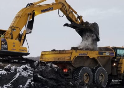 Crawler dumping sand in truck