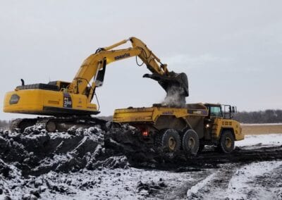 Crawler dumping sand in truck